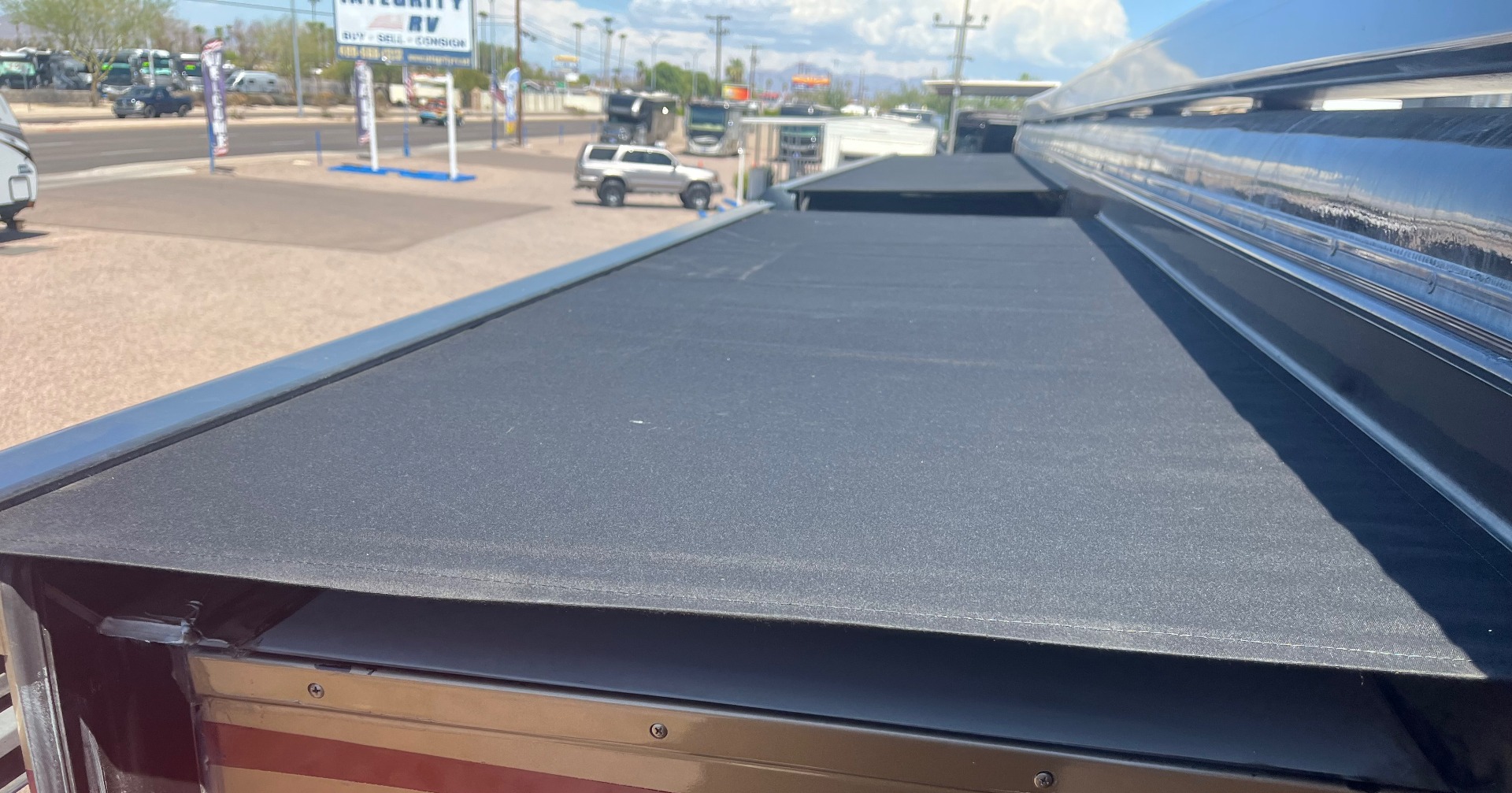 Fresh black awning fabric installed on the same RV